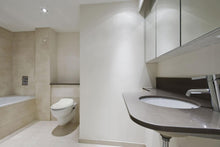 Load image into Gallery viewer, Bio Bidet BB-1000 Supreme Bidet Toilet Seat with Remote installed in bathroom
