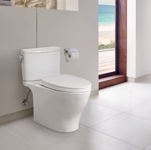 TOTO NEXUS® Two-Piece Toilet, 1.28 GPF, Elongated Bowl - MS442124CEFG#01, installed in spacious bathroom.