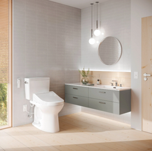 Load image into Gallery viewer, TOTO®  Drake Washlet®+ C5 Two-Piece Toilet - 1.28 GPF - MW7763084CEFG#01 - UNIVERSAL HEIGHT - installed in modern bathroom